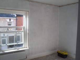 Walls replastered and white washed.