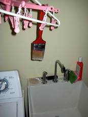 Wash brush with water and hang so it can drip dry.